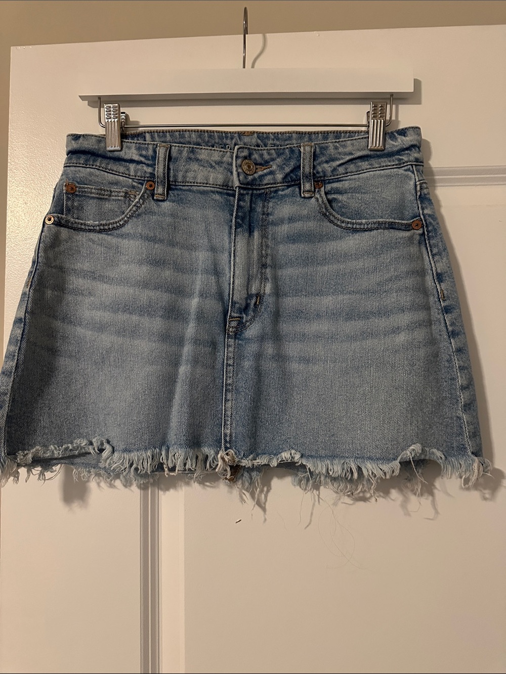 American Eagle Outfitters Light Wash Denim Mini Skirt with Frayed Hem